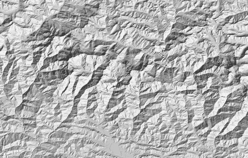 The Annapurna massif in Imhof relief — the static hillshade plate of the Gandaki survey window, standing in for the live terrain under reduced motion.